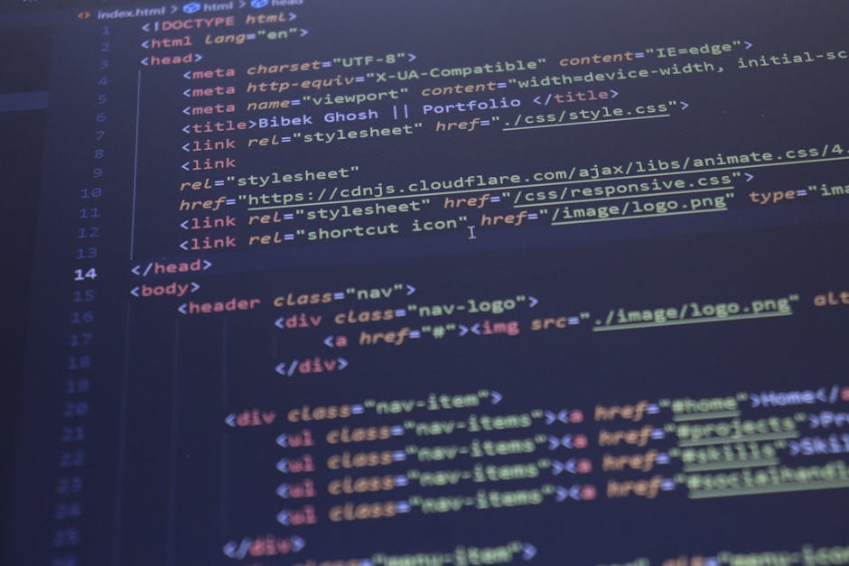 A close-up photograph of a computer screen displaying lines of colorful programming code, with text in shades of green, pink, blue, and white against a dark background. The code appears to be part of